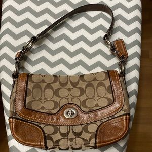 COACH leather trimmed mini bag, light brown and brown in color. Gently used